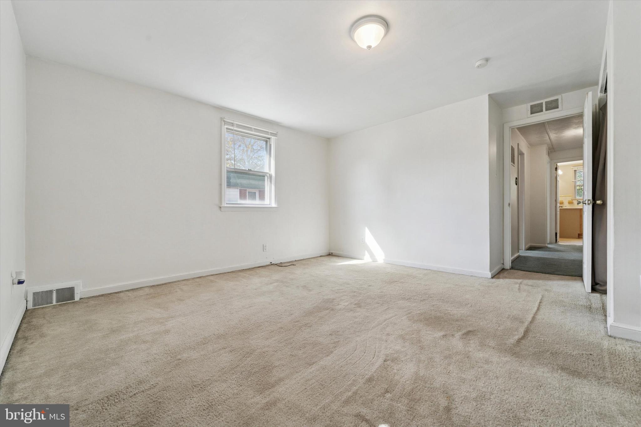 732 East 25th Street Chester, PA 19013 - Photo 12 of 25 an empty room with windows and closet