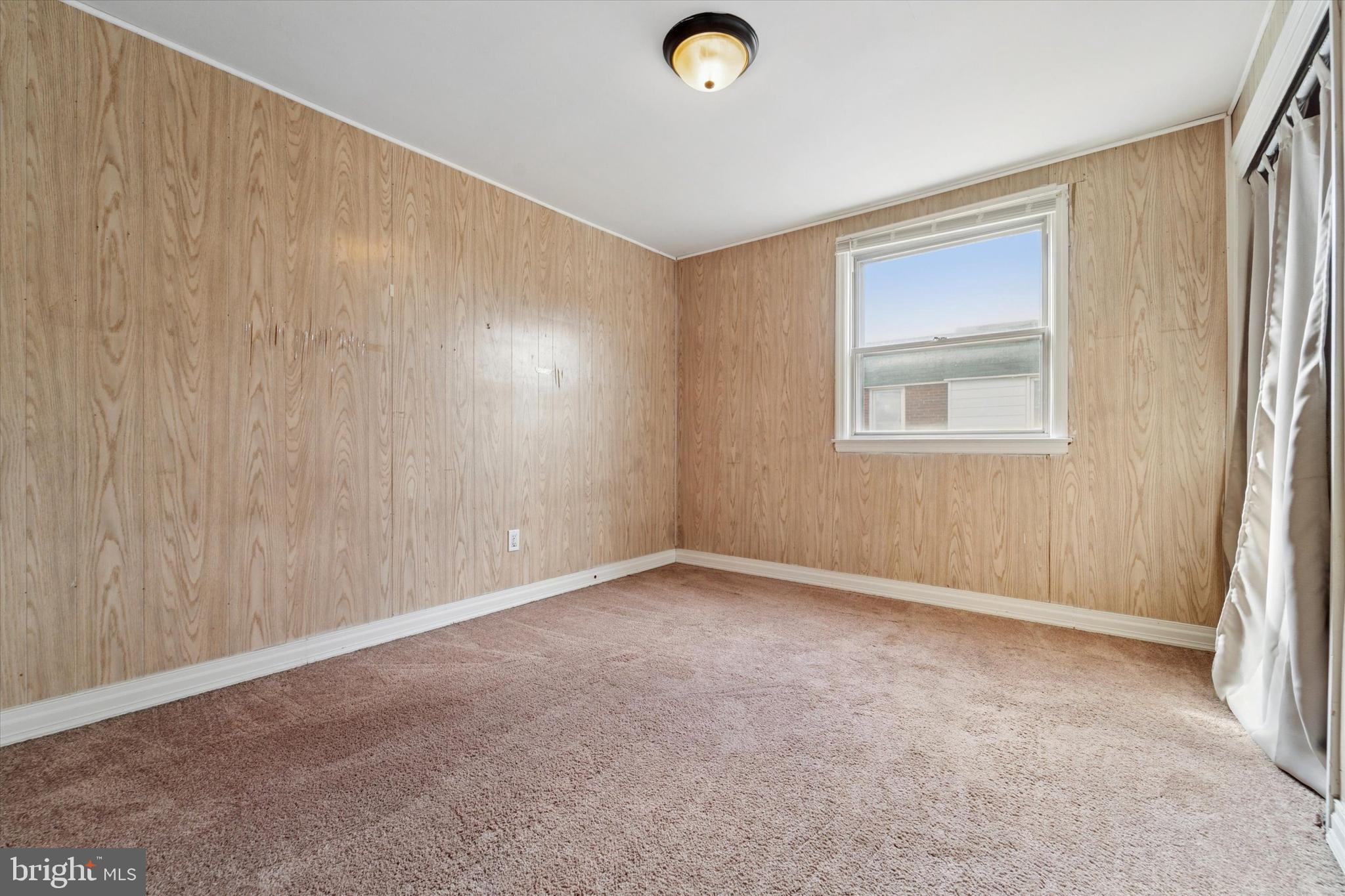 732 East 25th Street Chester, PA 19013 - Photo 16 of 25 an empty room with windows