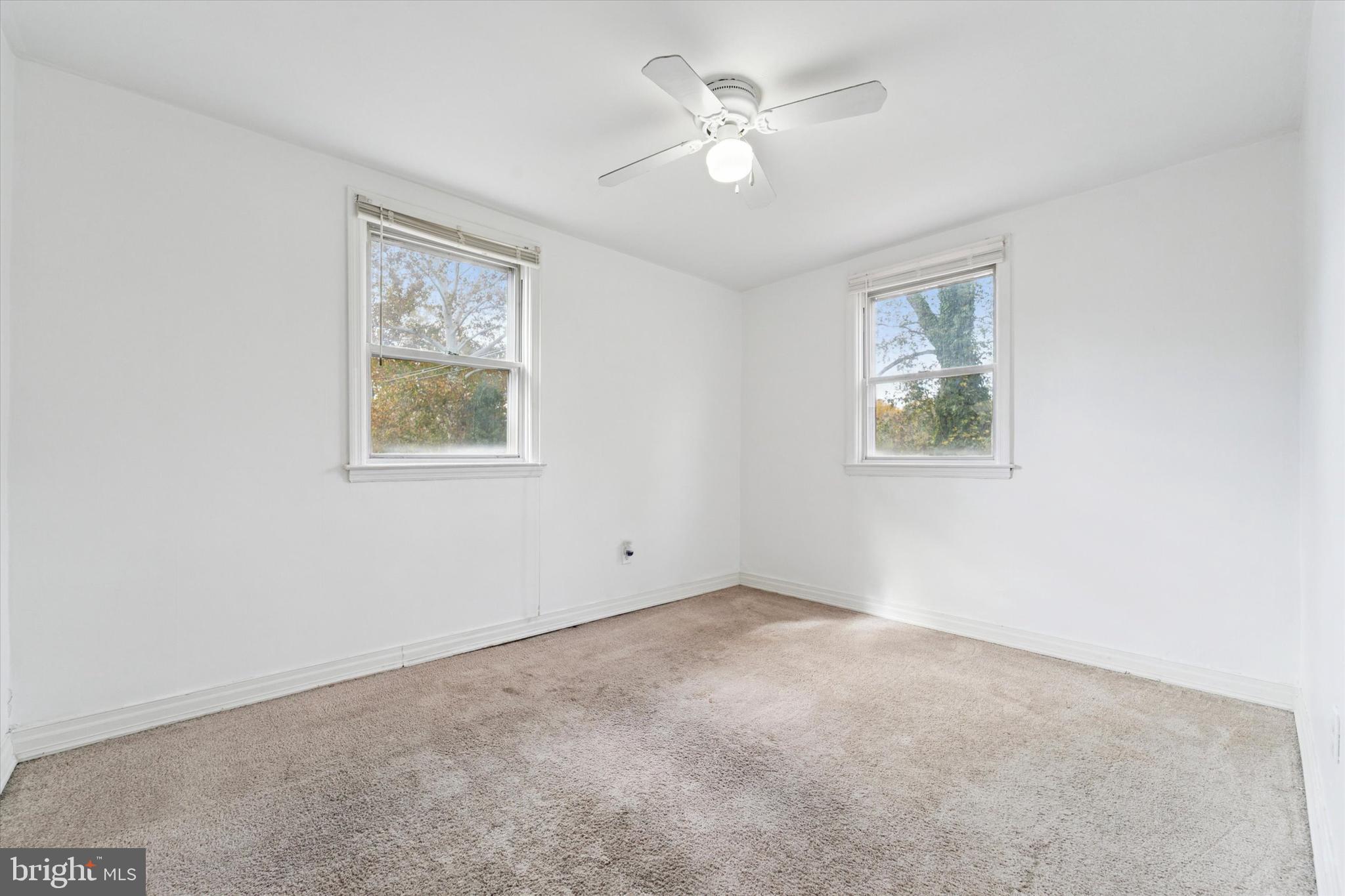 732 East 25th Street Chester, PA 19013 - Photo 18 of 25 an empty room with windows and closet