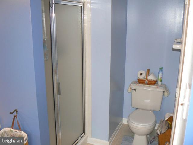 1739 Canal Run Drive Point of Rocks, MD 21777 - Photo 12 of 30 a white toilet sitting next to a bathroom sink