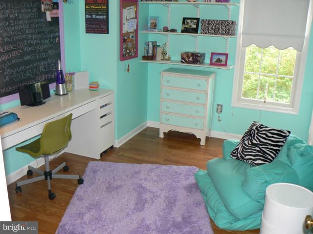 1739 Canal Run Drive Point of Rocks, MD 21777 - Photo 18 of 30 a bedroom with a bed and a chair