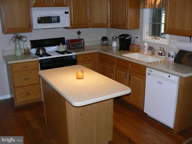 1739 Canal Run Drive Point of Rocks, MD 21777 - Photo 23 of 30 a kitchen with a sink a stove and cabinets