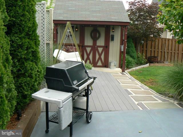 1739 Canal Run Drive Point of Rocks, MD 21777 - Photo 26 of 30 a backyard of a house with table and chairs