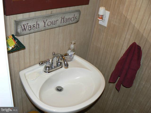 1739 Canal Run Drive Point of Rocks, MD 21777 - Photo 4 of 30 a bathroom with a sink and a mirror
