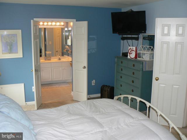 1739 Canal Run Drive Point of Rocks, MD 21777 - Photo 9 of 30 a bedroom with a bed and flat screen tv