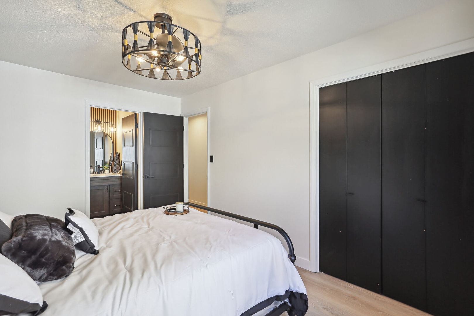 1817 Sadler Drive Champaign, IL 61821 - Photo 15 of 29 a bedroom with a bed and a chandelier