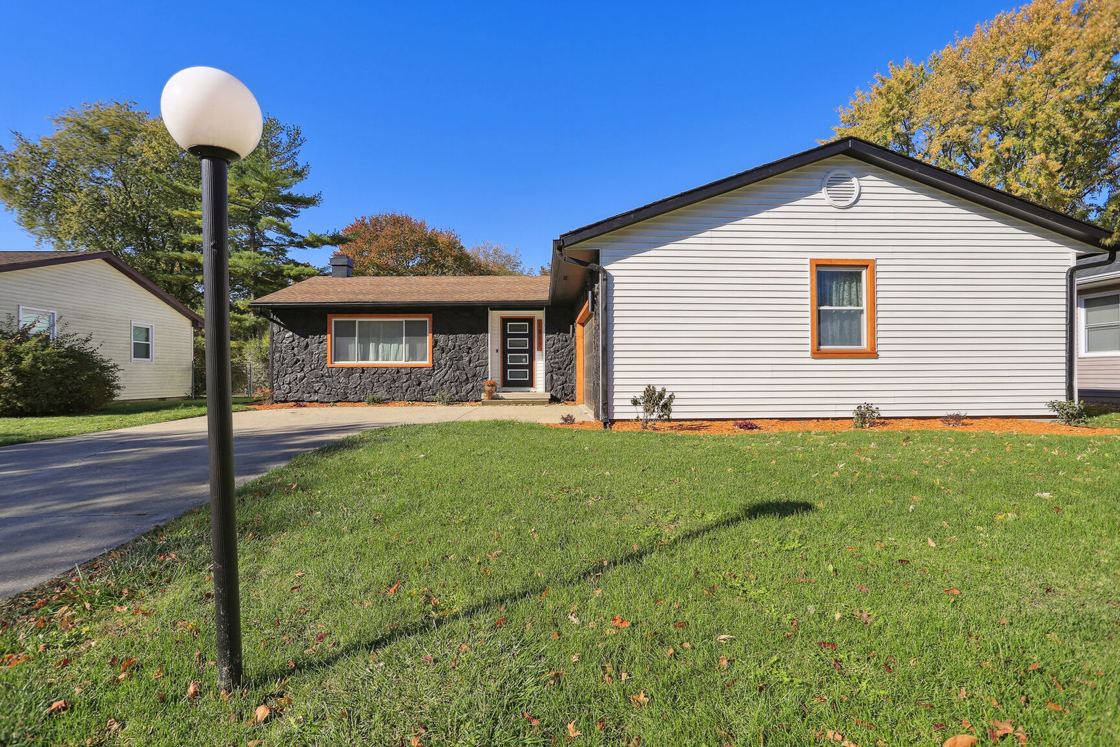 1817 Sadler Drive Champaign, IL 61821 - Photo 2 of 29 a front view of a house with garden