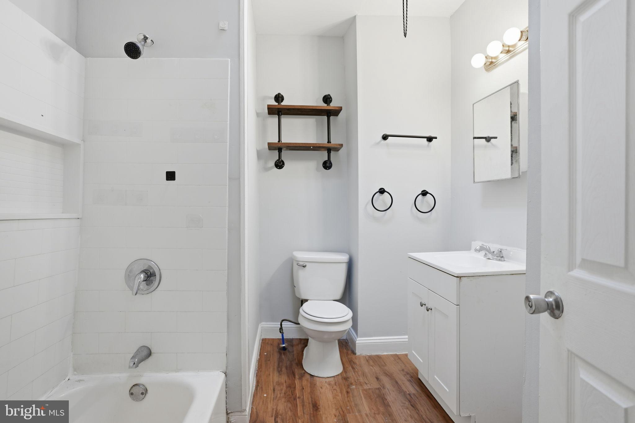 5563 Blakemore Street Philadelphia, PA 19138 - Photo 14 of 22 a bathroom with a sink toilet tub and shower