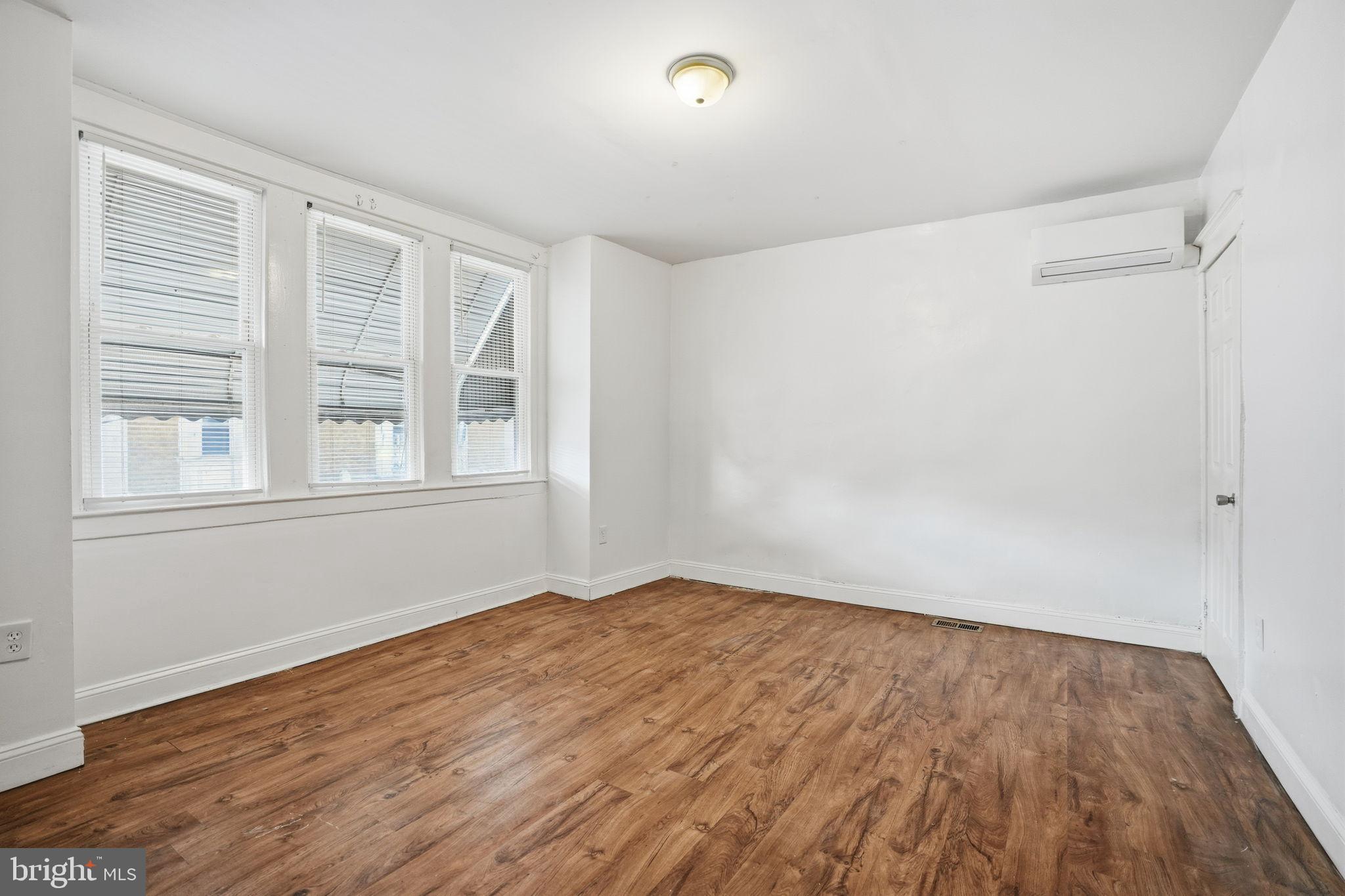 5563 Blakemore Street Philadelphia, PA 19138 - Photo 15 of 22 a view of empty room with wooden floor and fan