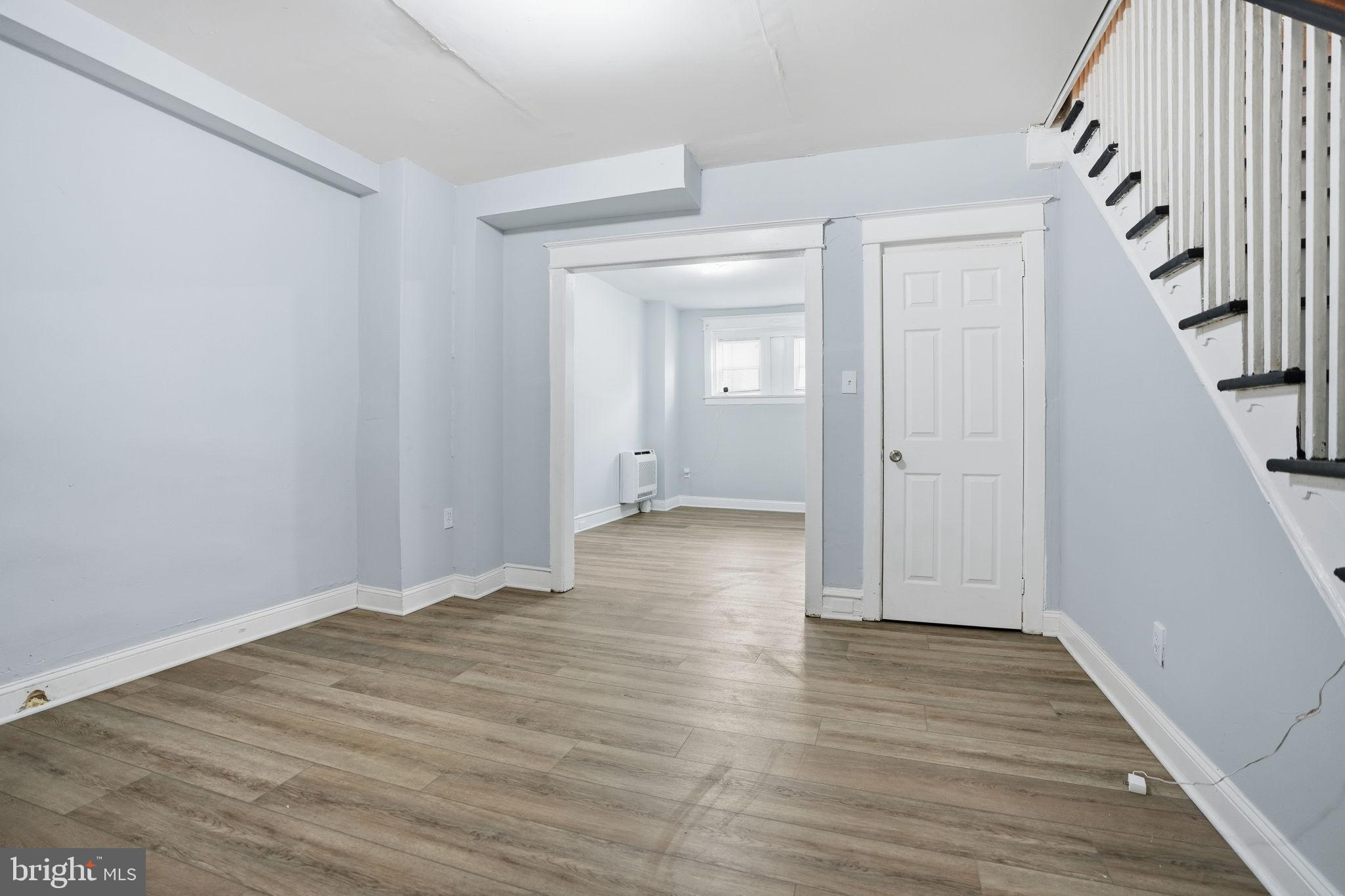 5563 Blakemore Street Philadelphia, PA 19138 - Photo 4 of 22 wooden floor and white walls