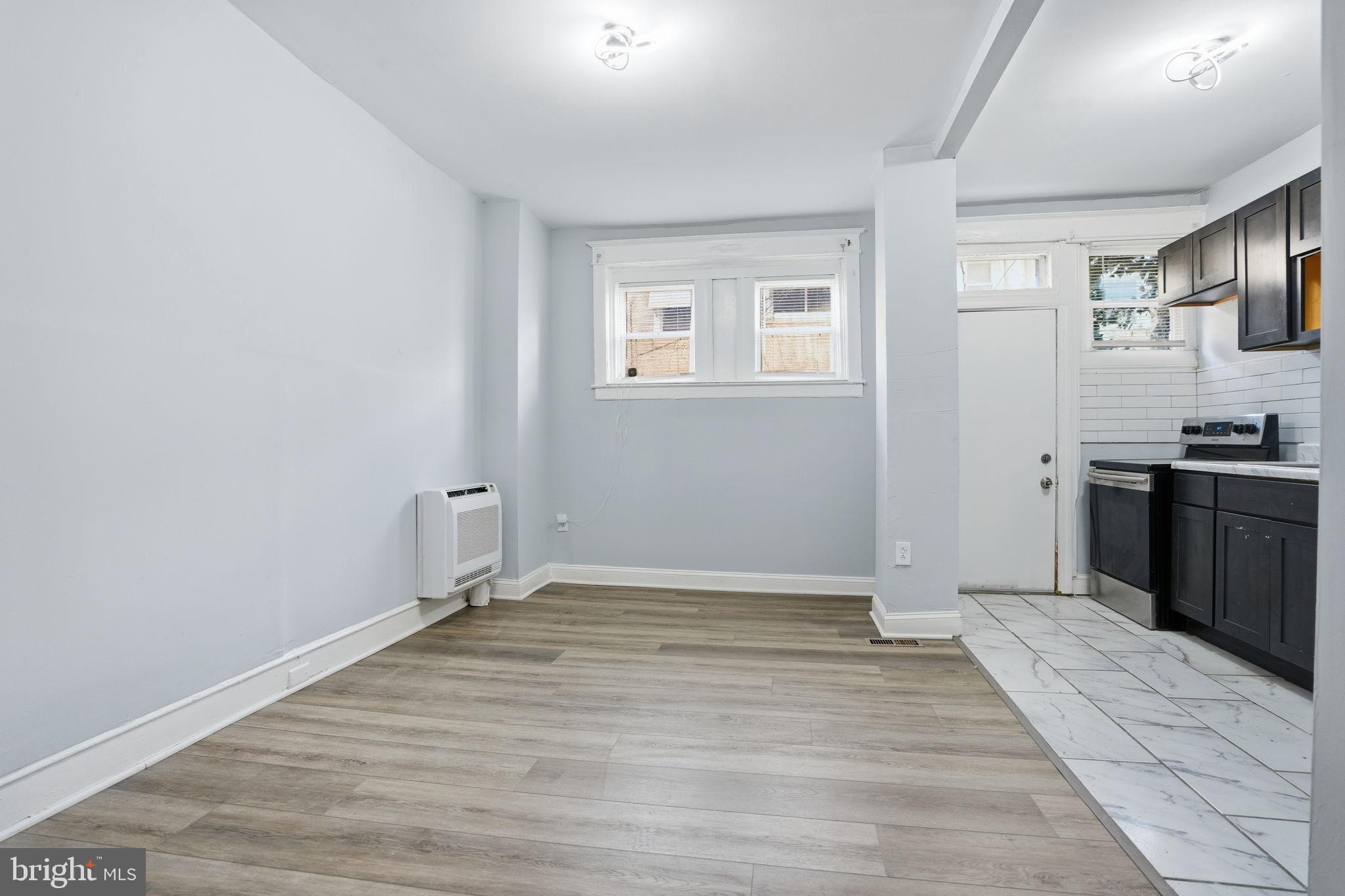 5563 Blakemore Street Philadelphia, PA 19138 - Photo 6 of 22 a view of a kitchen with dishwasher and wooden floor