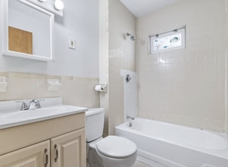 156 Lexington Street, Unit 1 Boston, MA 02128 - Photo 8 of 12 a bathroom with a sink a toilet and bathtub