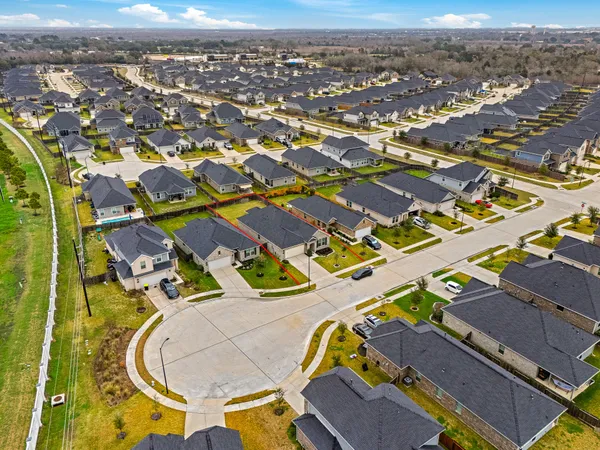 an aerial view of residential house with outdoor space and swimming pool