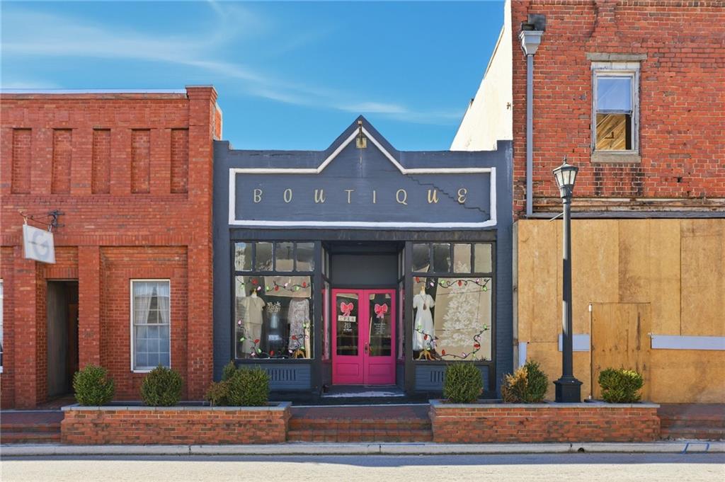 5.130 Acres On Orlando Path Dallas, GA 30157 - Photo 16 of 17 a front view of a building with glass windows