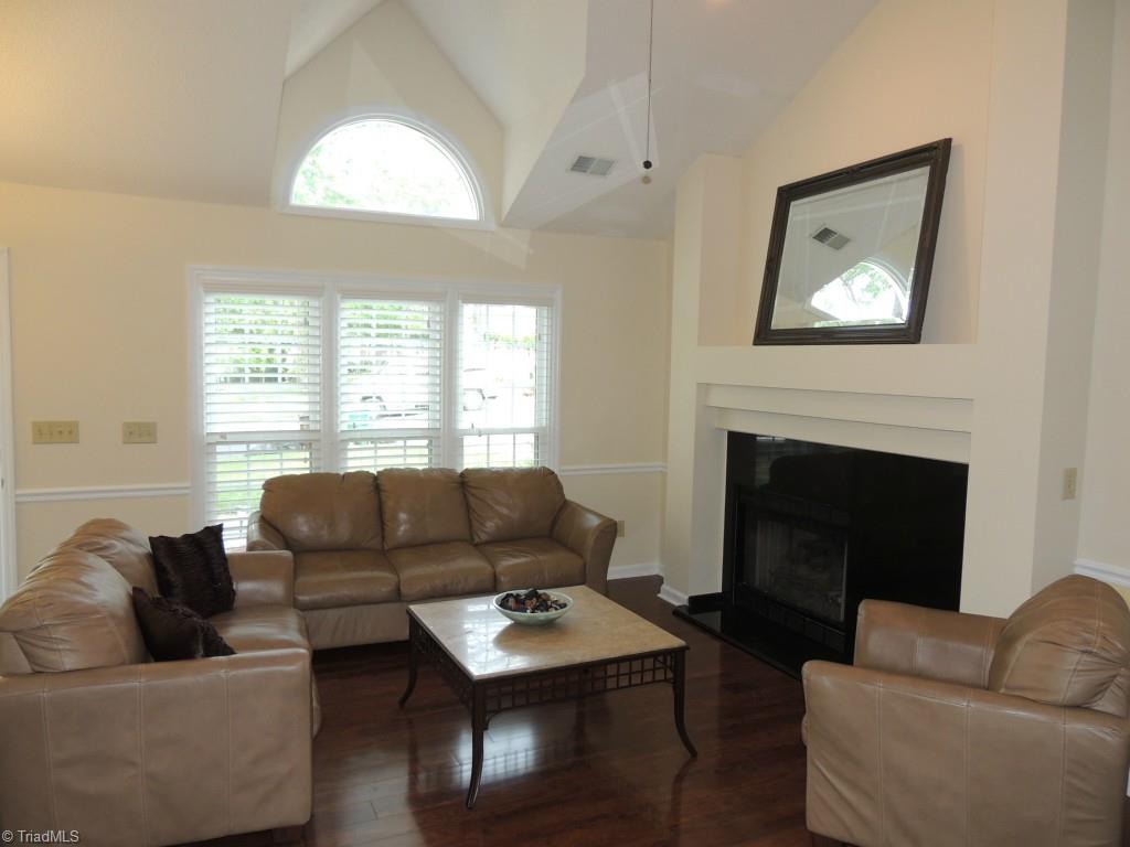 3326 Timberwolf Avenue High Point, NC 27265 - Photo 8 of 25 Beautiful flooring and bright windows accent the living room!