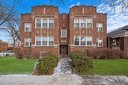 543 East 77th Street, Unit 2 Chicago, IL 60619 - Photo 1 of 6 a front view of building with a yard
