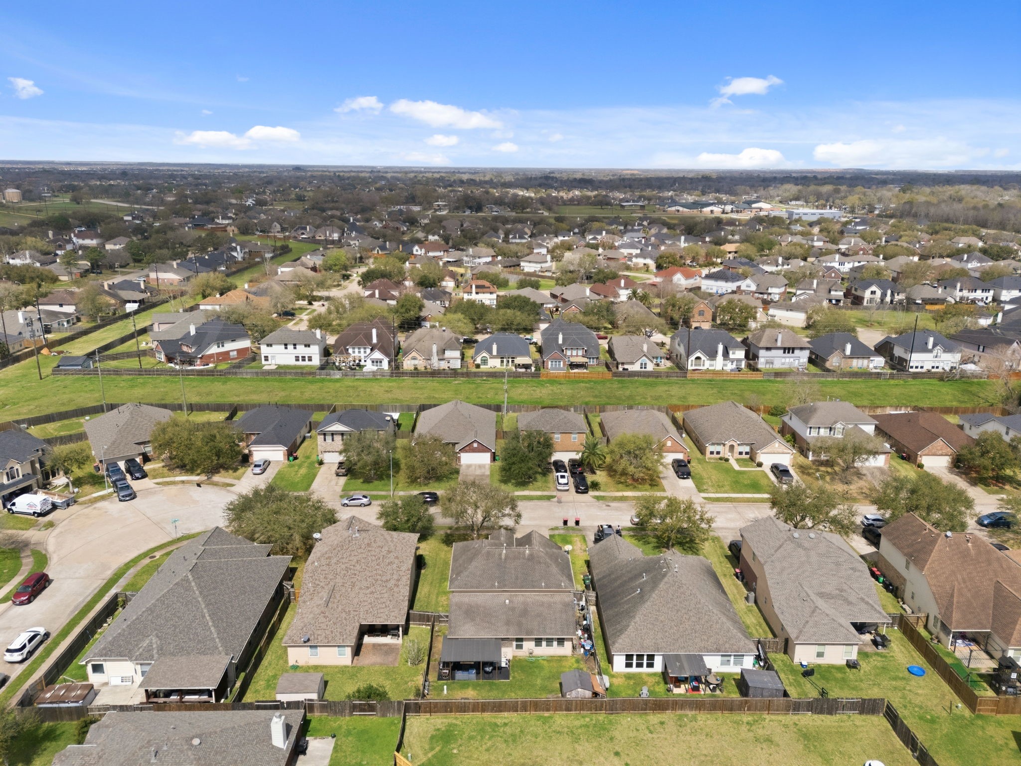1319 Collier Point Lane Fresno, TX 77545 - Photo 32 of 33 This wide aerial perspective highlights the serene neighborhood setting, nearby green spaces, and the quiet streets that contribute to the area’s welcoming atmosphere.
