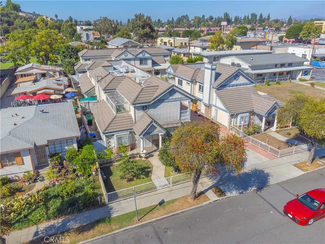 an aerial view of residential houses and outdoor space