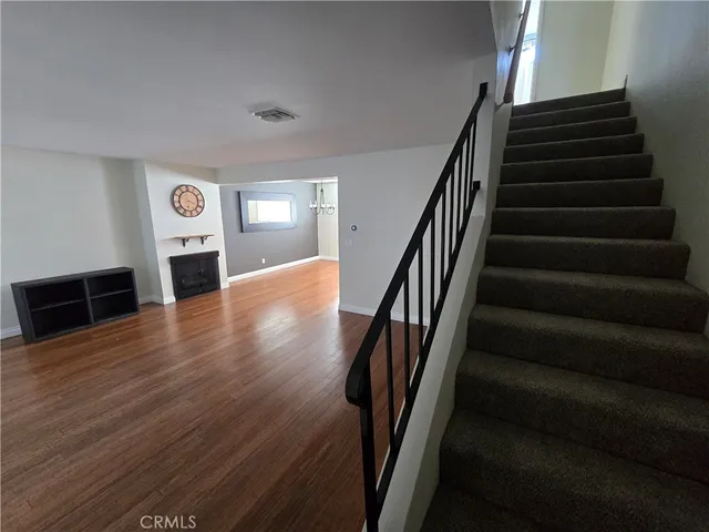 a bathroom with a granite countertop sink mirror vanity and toilet