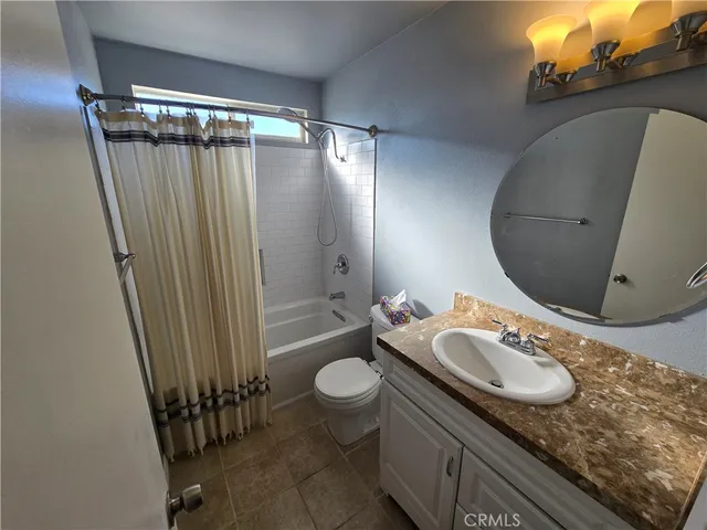 an empty room with a mirror