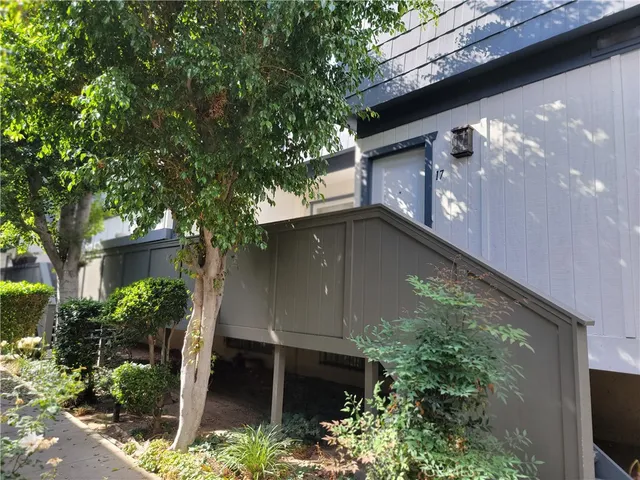 a house with trees in front of it