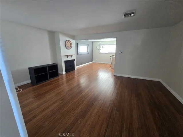 a view of a livingroom with wooden floor