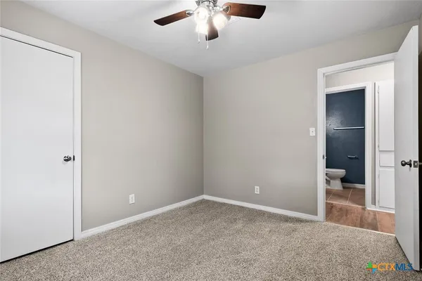 an empty room with a bathroom