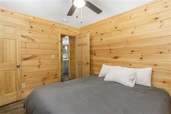 a bedroom with a bed and a walk in closet