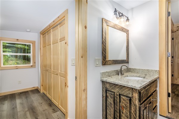 1519 Tipton Springs Road Morganton, GA 30560 - Photo 17 of 46 a bathroom with a sink and a mirror