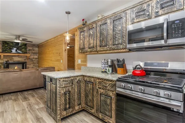 a view of a lush green forest with lots of trees