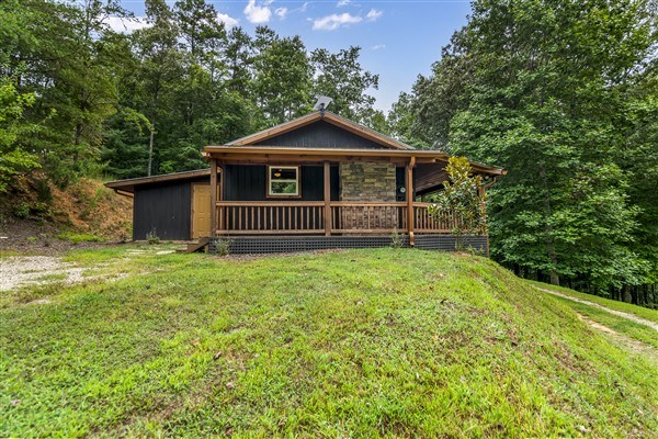 1519 Tipton Springs Road Morganton, GA 30560 - Photo 33 of 46 a front view of a house with garden