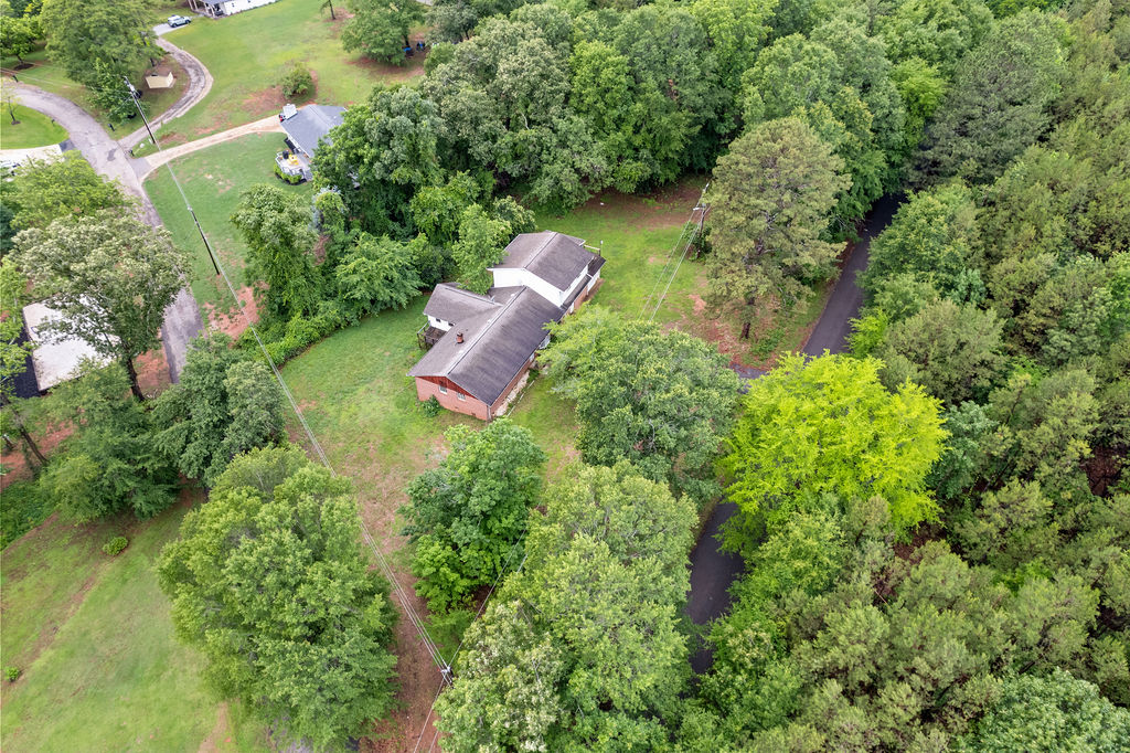 712 Whitney Way Anderson, SC 29625 - Photo 2 of 31 Discover a private woodland retreat featuring an inviting brick home nestled among mature trees.