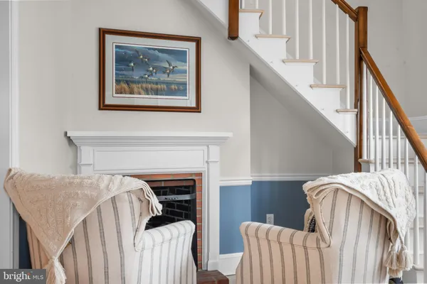 a bedroom with a bed and a fireplace