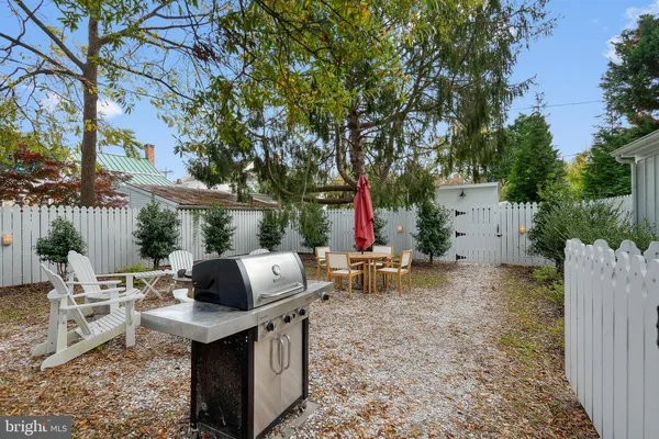 a view of backyard with sitting area