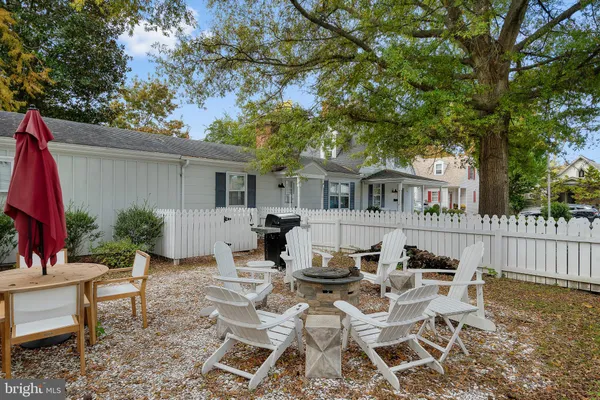 a view of a patio with table and chairs and potted plants