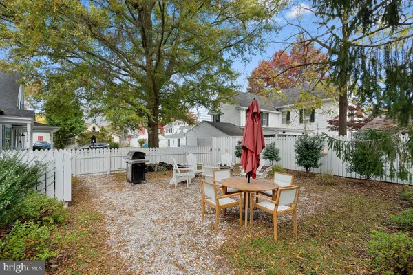a backyard of a house with outdoor seating