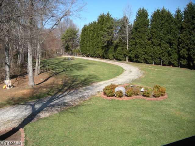 6613 Coltrane Mill Road Greensboro, NC 27406 - Photo 13 of 16 Exterior Front. Driveway view from house