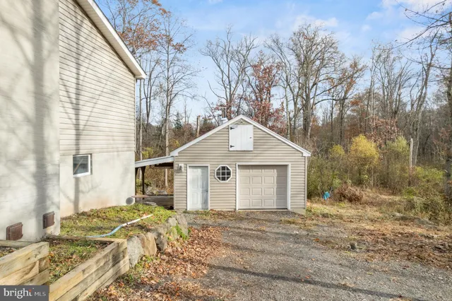 a view of a house with a yard covered in snow