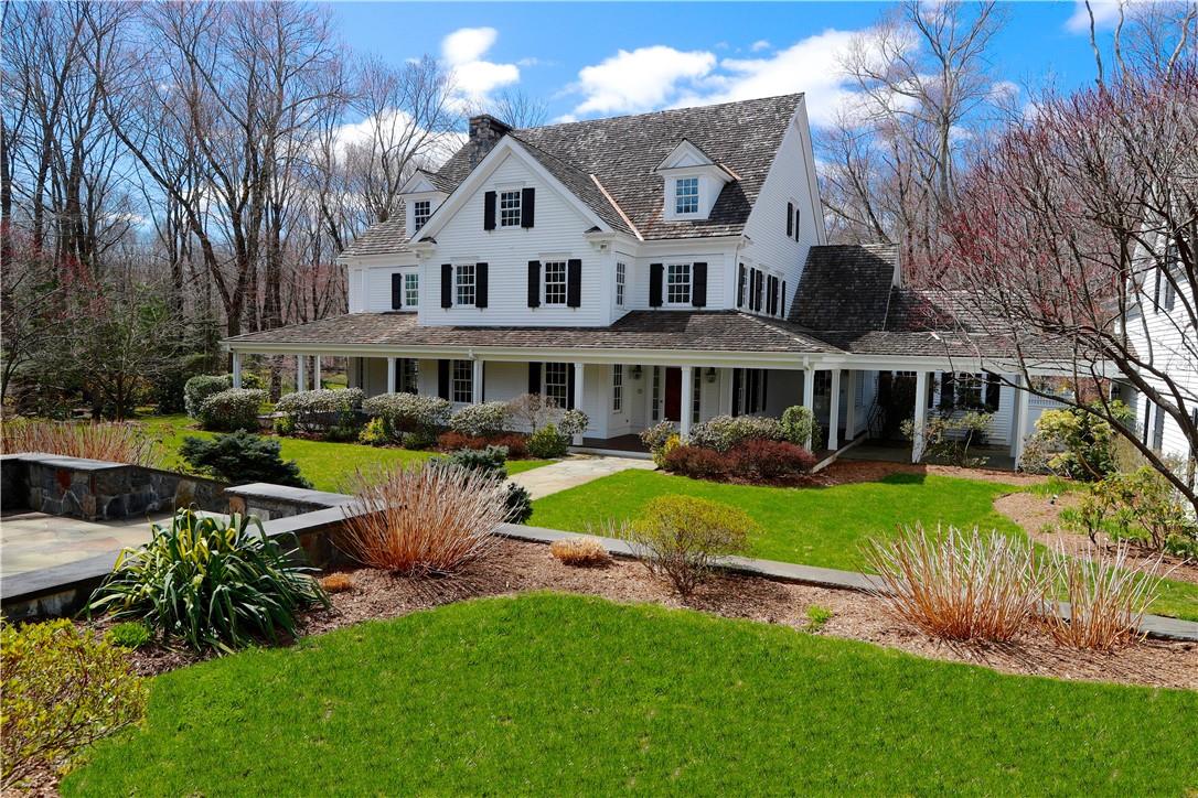 42 Stone Paddock Place Bedford, NY 10506 - Photo 1 of 1 a front view of a house with a yard table and chairs