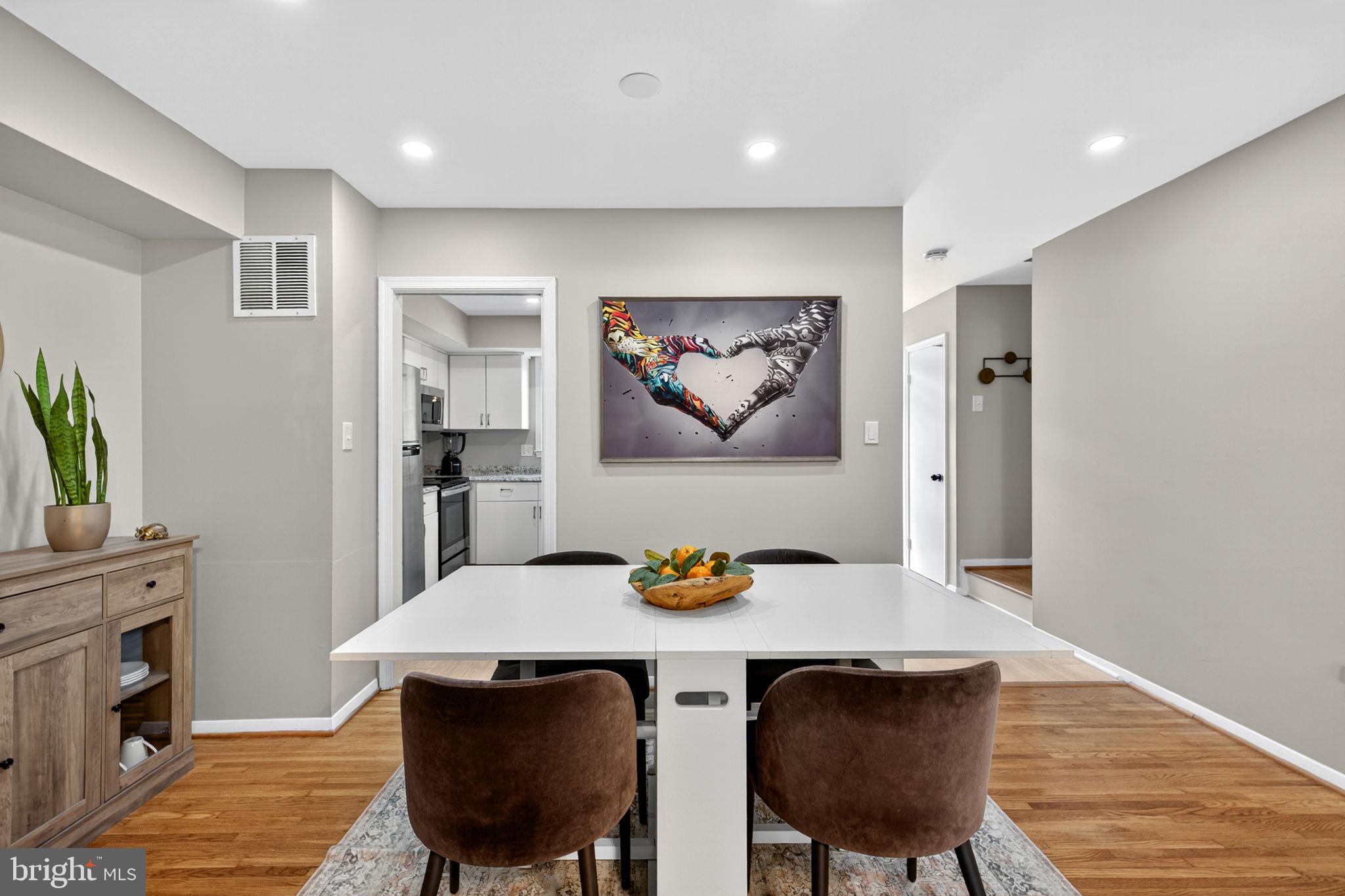 6517 Orono Court Springfield, VA 22152 - Photo 11 of 64 a view of a dining room with furniture and wooden floor