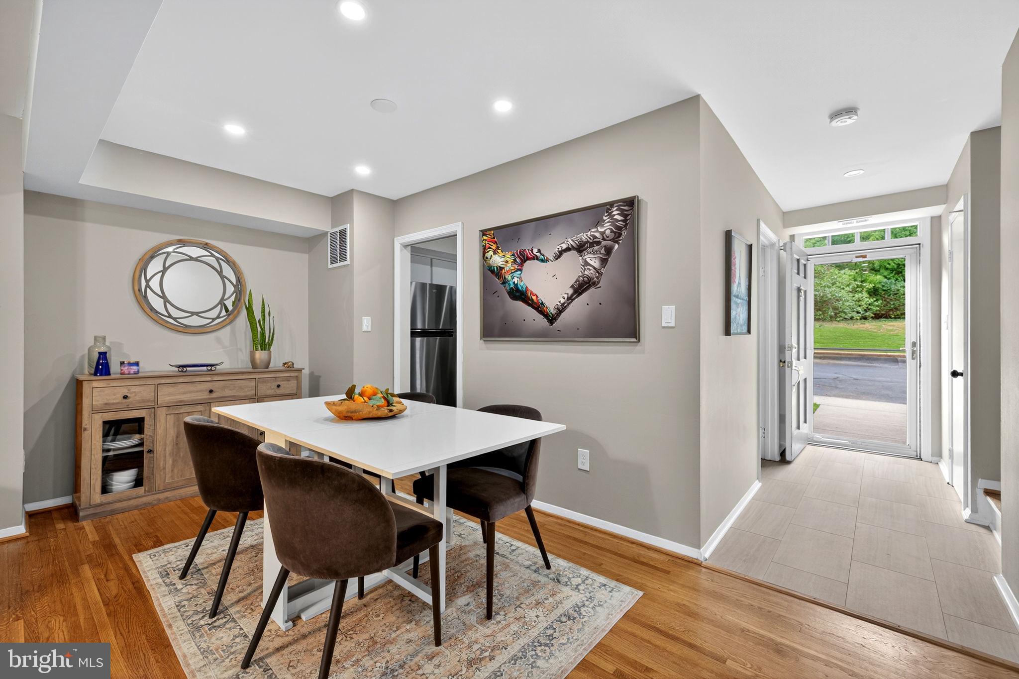 6517 Orono Court Springfield, VA 22152 - Photo 12 of 64 a view of a dining room with furniture window and wooden floor