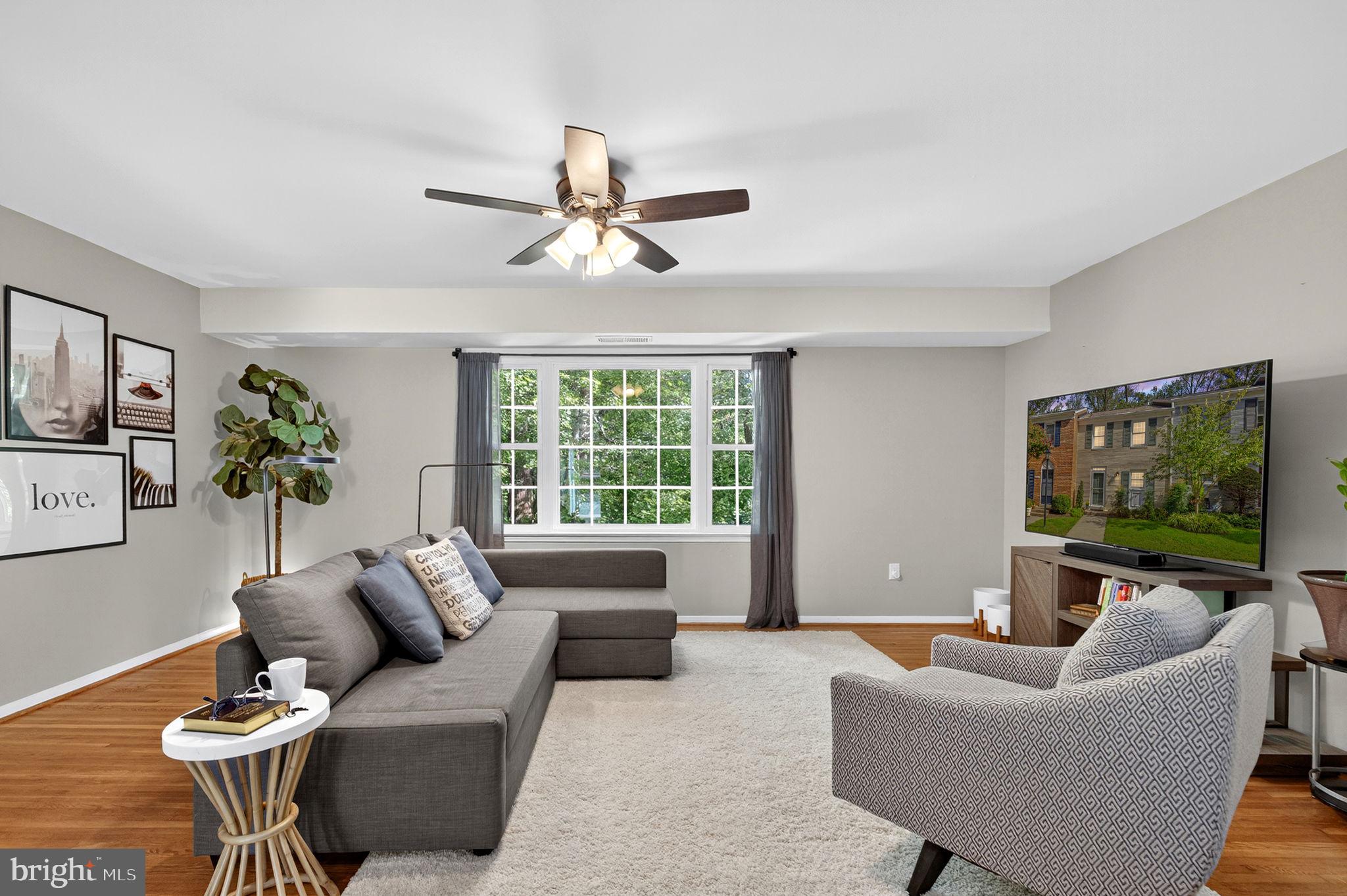 6517 Orono Court Springfield, VA 22152 - Photo 16 of 64 a living room with furniture and a flat screen tv