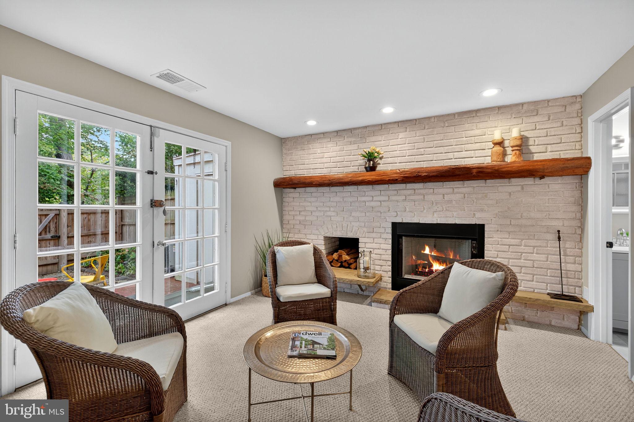 6517 Orono Court Springfield, VA 22152 - Photo 23 of 64 a living room with furniture and a fireplace