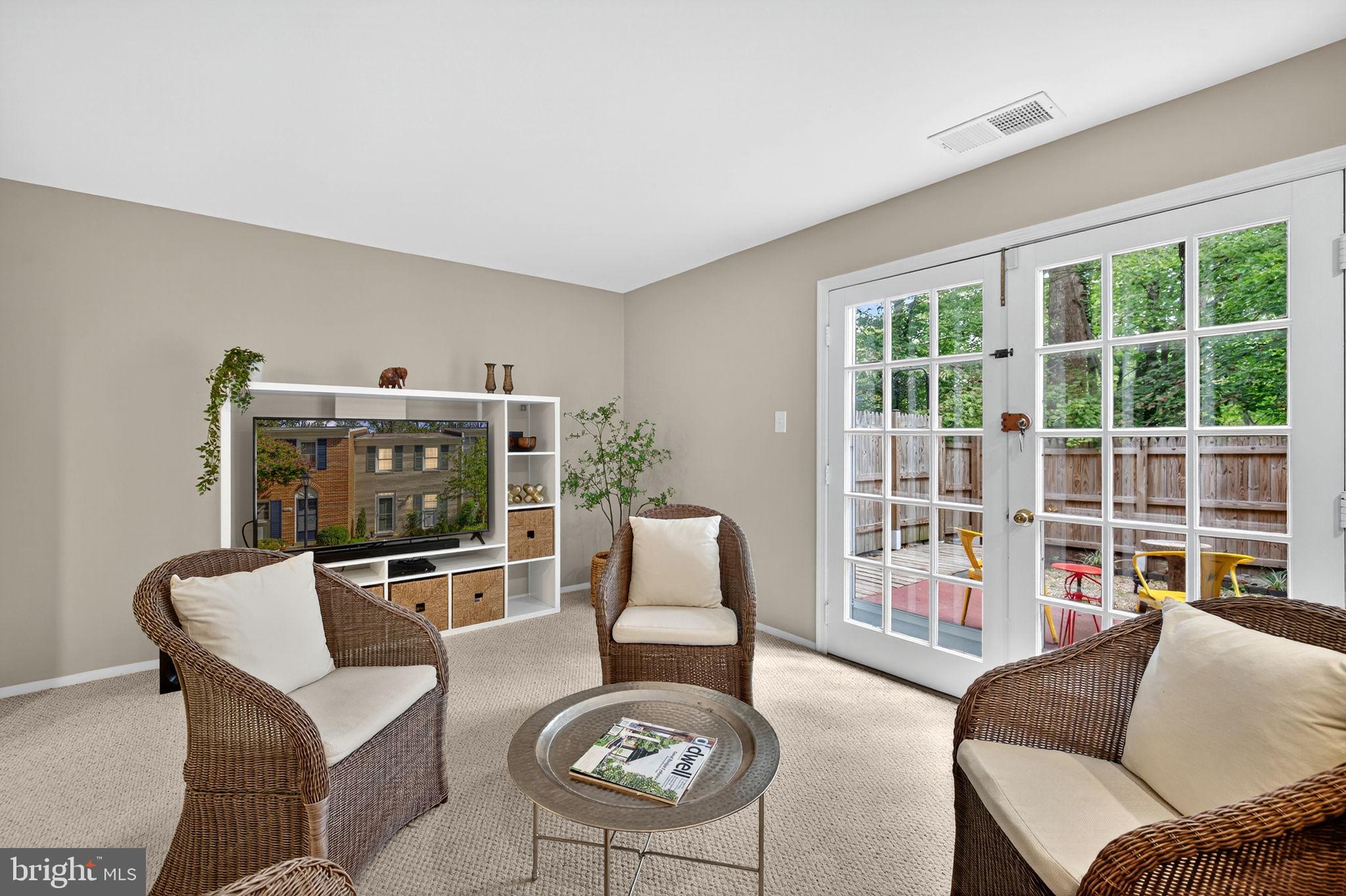 6517 Orono Court Springfield, VA 22152 - Photo 24 of 64 a living room with furniture and a flat screen tv