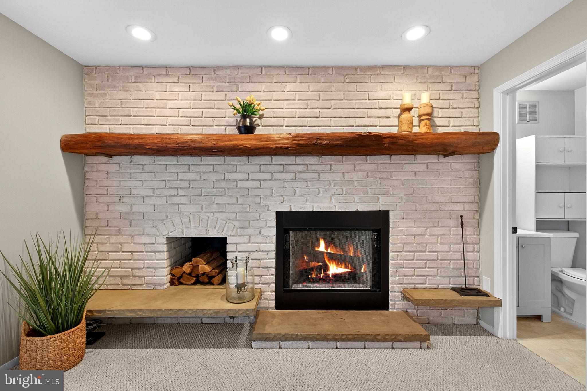 6517 Orono Court Springfield, VA 22152 - Photo 26 of 64 a living room with furniture and a fireplace
