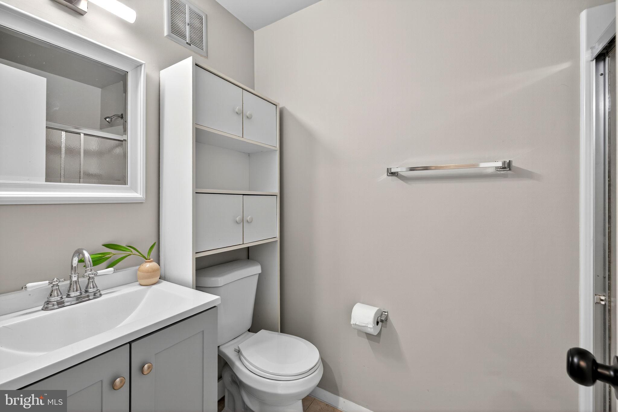 6517 Orono Court Springfield, VA 22152 - Photo 29 of 64 a bathroom with a sink a toilet and a mirror