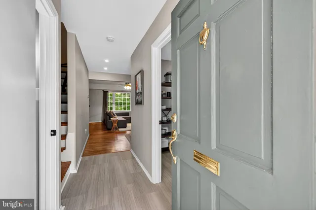 a view of an entryway with wooden floor