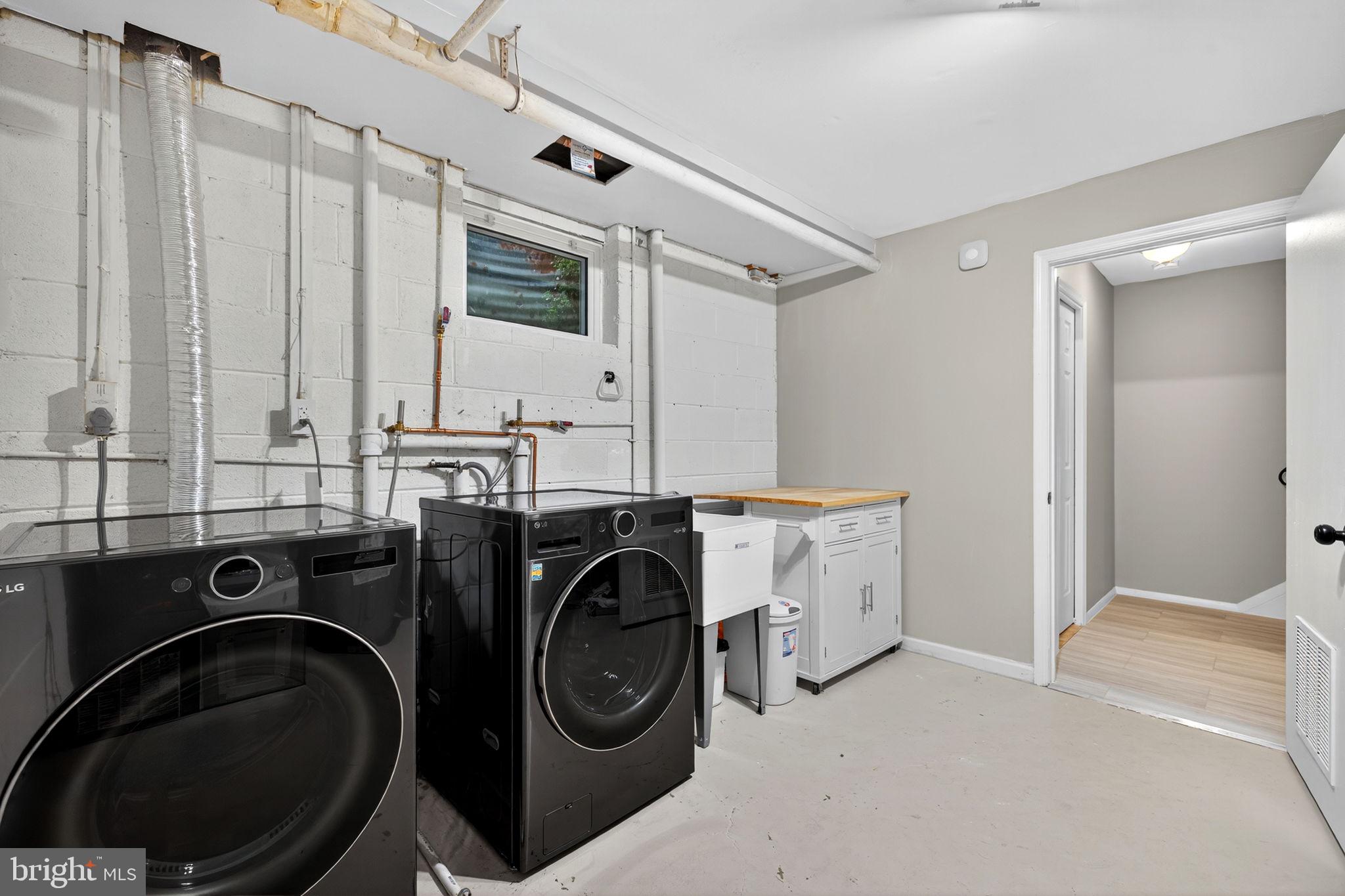 6517 Orono Court Springfield, VA 22152 - Photo 32 of 64 a utility room with sink dryer and washer
