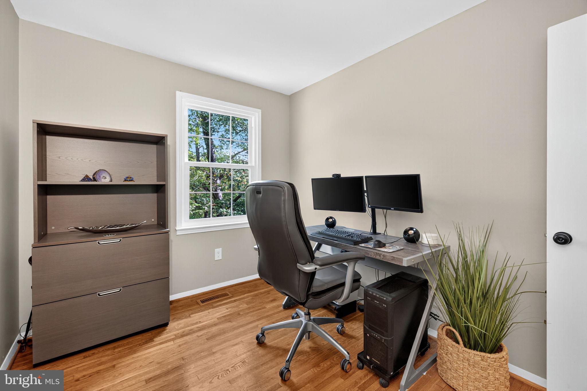 6517 Orono Court Springfield, VA 22152 - Photo 43 of 64 a workspace with furniture and a potted plant