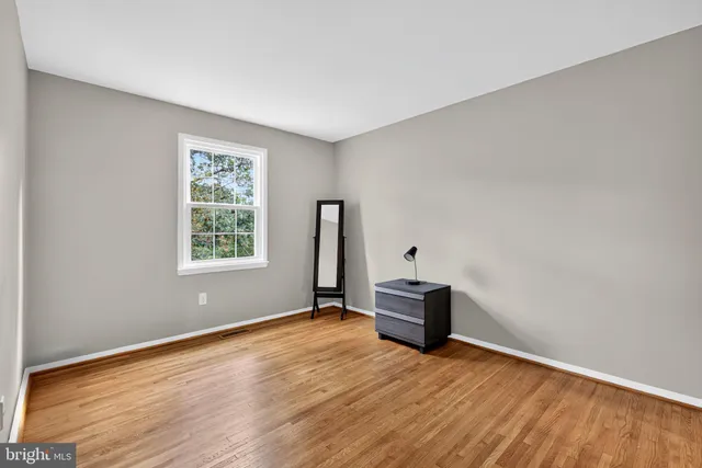 a backyard of a house with portable swimming pool and trees